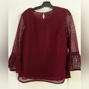 Ann Taylor wine colored top, size M. Lined, bell shaped sleeves.